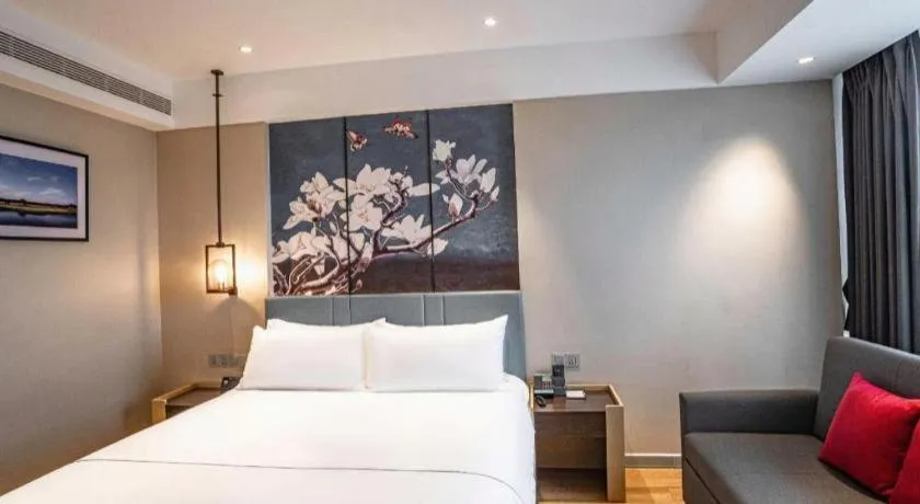 Bed in Magnotel Hotel Guangyuan Nanhe Bus Station Beijing Road