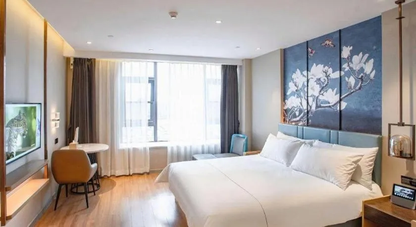 Bed in Magnotel Hotel Guangyuan Nanhe Bus Station Beijing Road