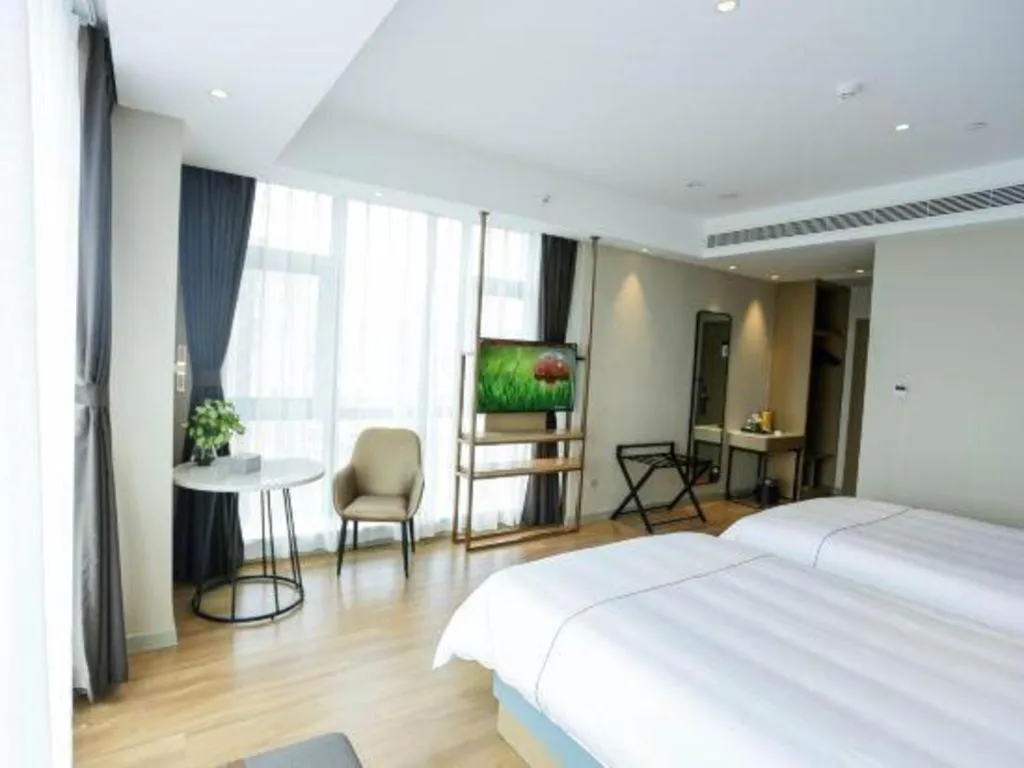 Bed in Magnotel Hotel Guangyuan Nanhe Bus Station Beijing Road