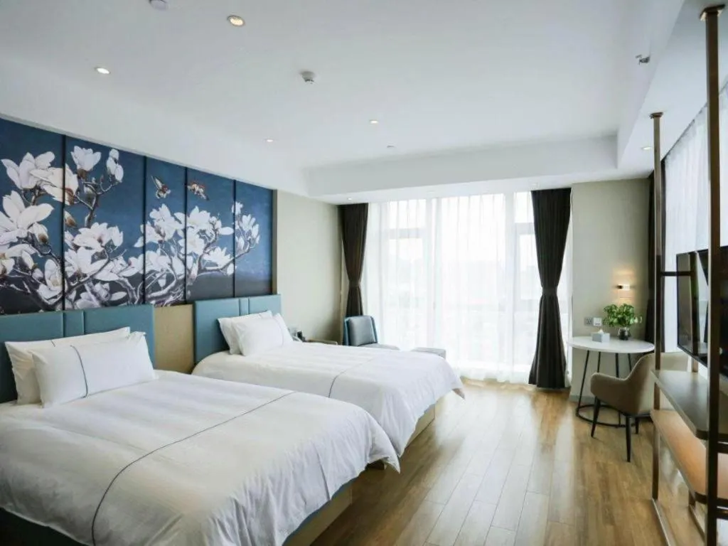 Bed in Magnotel Hotel Guangyuan Nanhe Bus Station Beijing Road