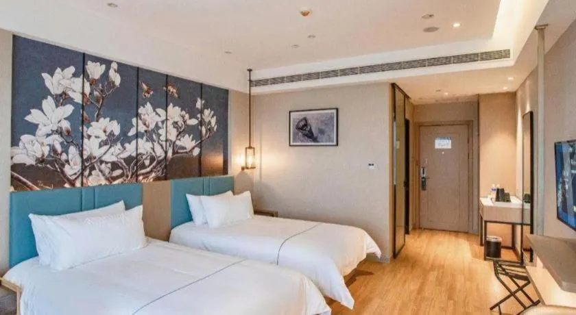 Bed in Magnotel Hotel Guangyuan Nanhe Bus Station Beijing Road