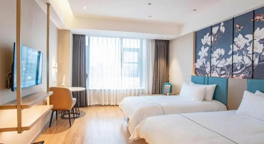 Bed in Magnotel Hotel Guangyuan Nanhe Bus Station Beijing Road