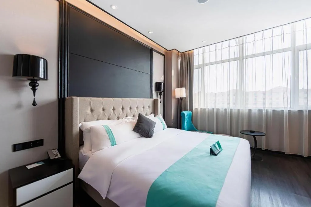 Bed in Xana Hotelle Binzhou Yangxin