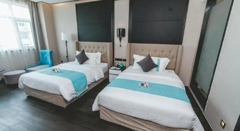 Bed in Xana Hotelle Binzhou Yangxin