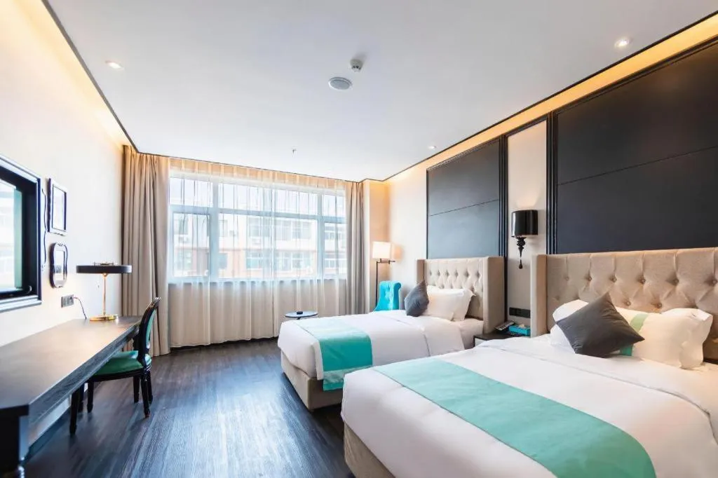 Bed in Xana Hotelle Binzhou Yangxin