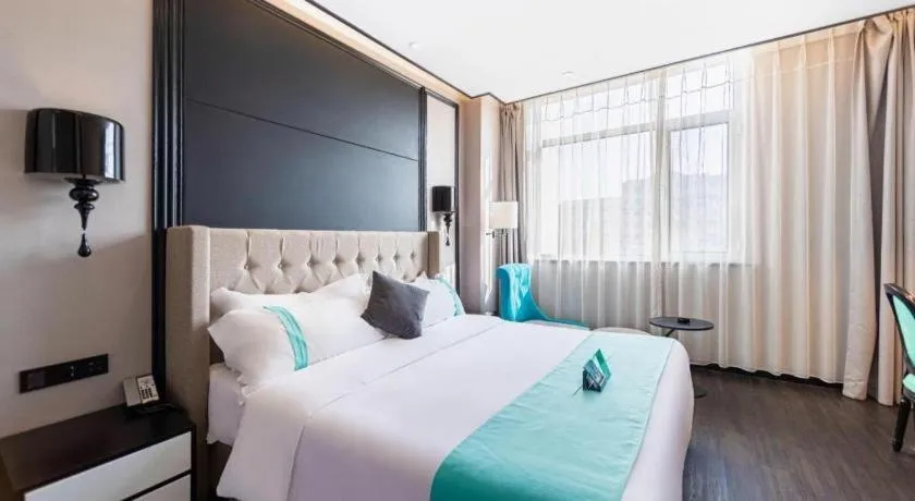 Bed in Xana Hotelle Binzhou Yangxin