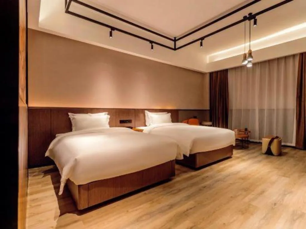 Bed in ZMAX Hotel Yan'an Baimi Avenue Baotashan