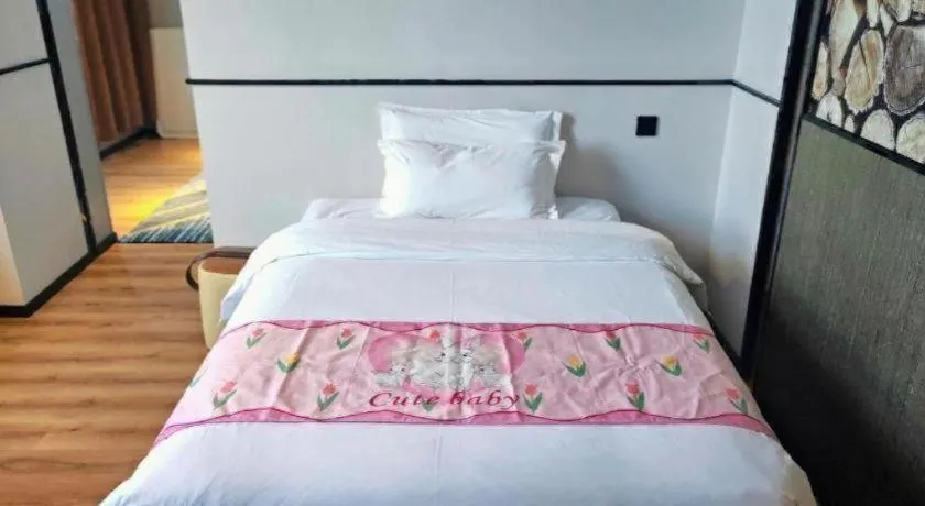 Bed in ZMAX Hotel Yan'an Baimi Avenue Baotashan