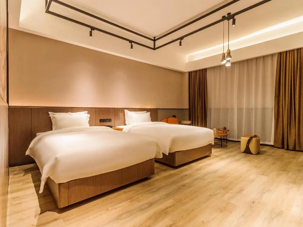 Bed in ZMAX Hotel Yan'an Baimi Avenue Baotashan