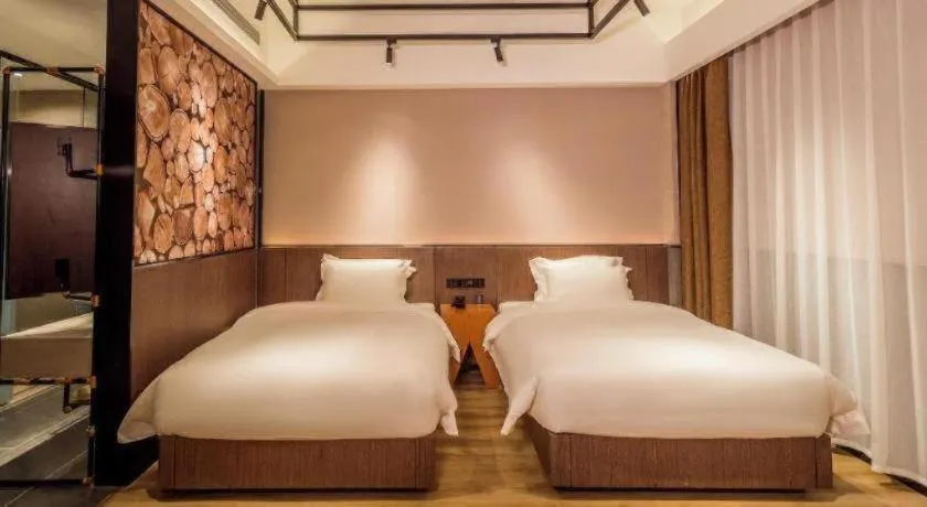 Bed in ZMAX Hotel Yan'an Baimi Avenue Baotashan