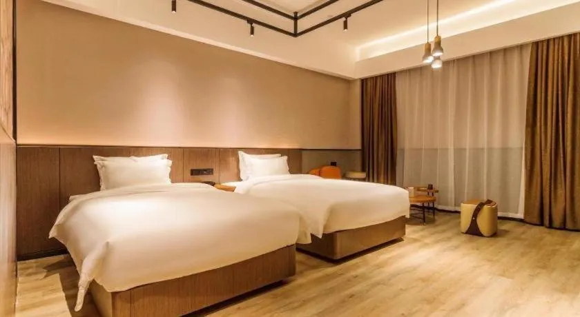 Bed in ZMAX Hotel Yan'an Baimi Avenue Baotashan