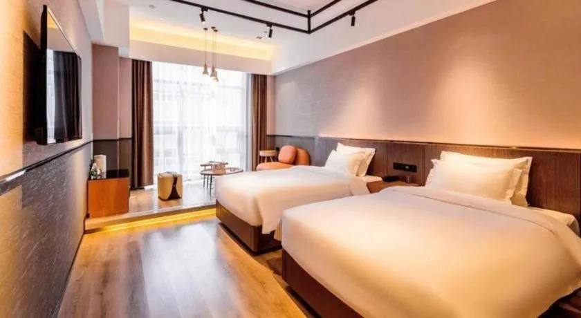 Bed in ZMAX Hotel Yan'an Baimi Avenue Baotashan