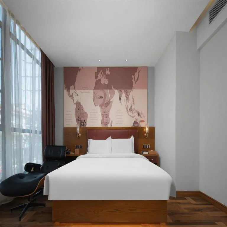 Bed in James Joyce Coffetel Luoyang Longmen High-speed Railway Station Baolong Plaza