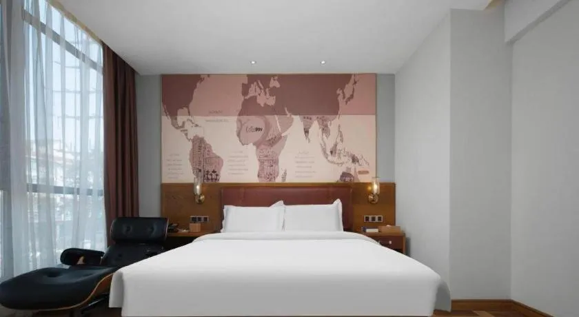 Bed in James Joyce Coffetel Luoyang Longmen High-speed Railway Station Baolong Plaza