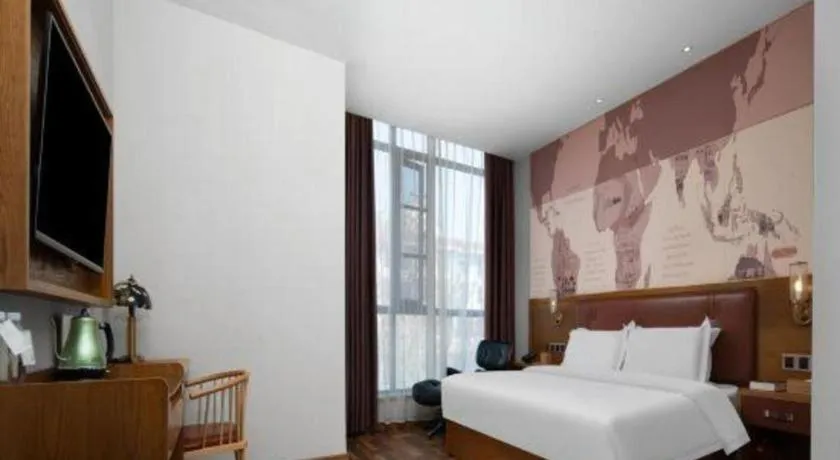 Bed in James Joyce Coffetel Luoyang Longmen High-speed Railway Station Baolong Plaza