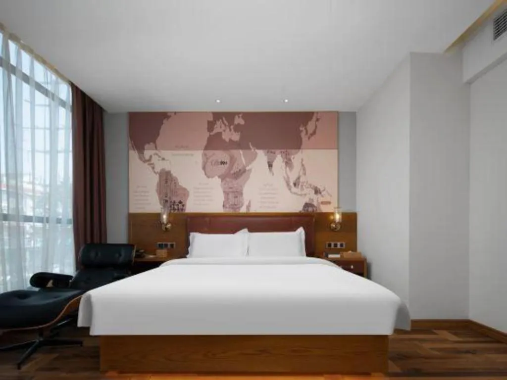 Bed in James Joyce Coffetel Luoyang Longmen High-speed Railway Station Baolong Plaza