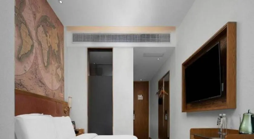 Bed in James Joyce Coffetel Luoyang Longmen High-speed Railway Station Baolong Plaza