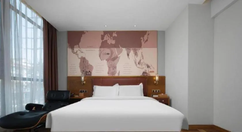 Bed in James Joyce Coffetel Luoyang Longmen High-speed Railway Station Baolong Plaza