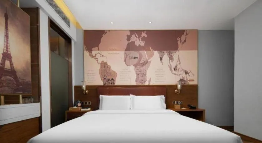 Bed in James Joyce Coffetel Luoyang Longmen High-speed Railway Station Baolong Plaza