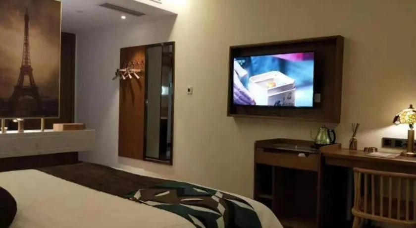 Bed in James Joyce Coffetel Luoyang Longmen High-speed Railway Station Baolong Plaza