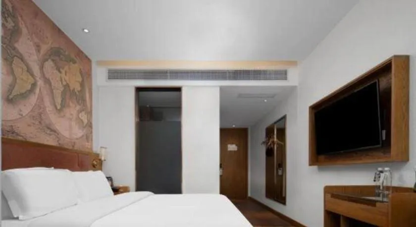 Bed in James Joyce Coffetel Luoyang Longmen High-speed Railway Station Baolong Plaza