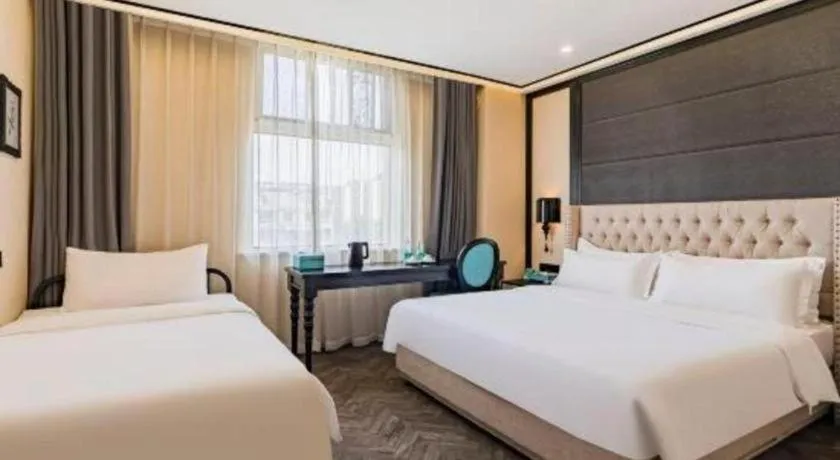 Bed in Xana Lite Hotelle Tianjin Huaming Binhai International Airport