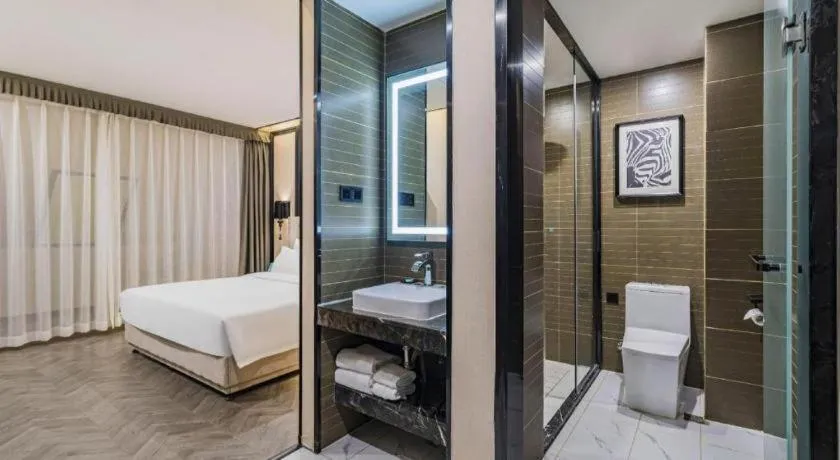 Bed in Xana Lite Hotelle Tianjin Huaming Binhai International Airport