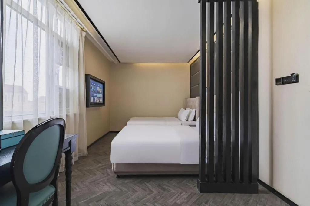 Bed in Xana Lite Hotelle Tianjin Huaming Binhai International Airport