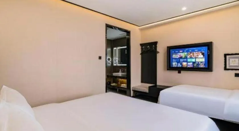 Bed in Xana Lite Hotelle Tianjin Huaming Binhai International Airport
