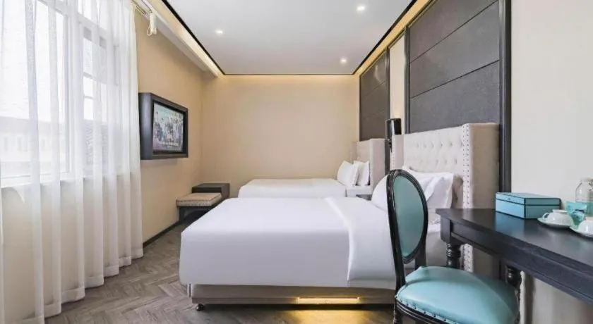Bed in Xana Lite Hotelle Tianjin Huaming Binhai International Airport