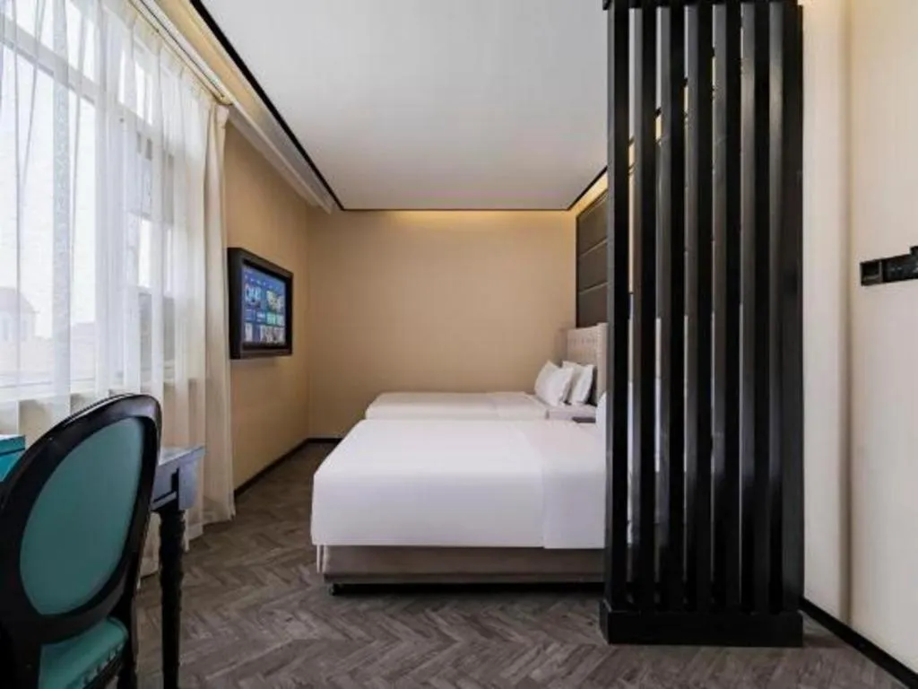 Bed in Xana Lite Hotelle Tianjin Huaming Binhai International Airport