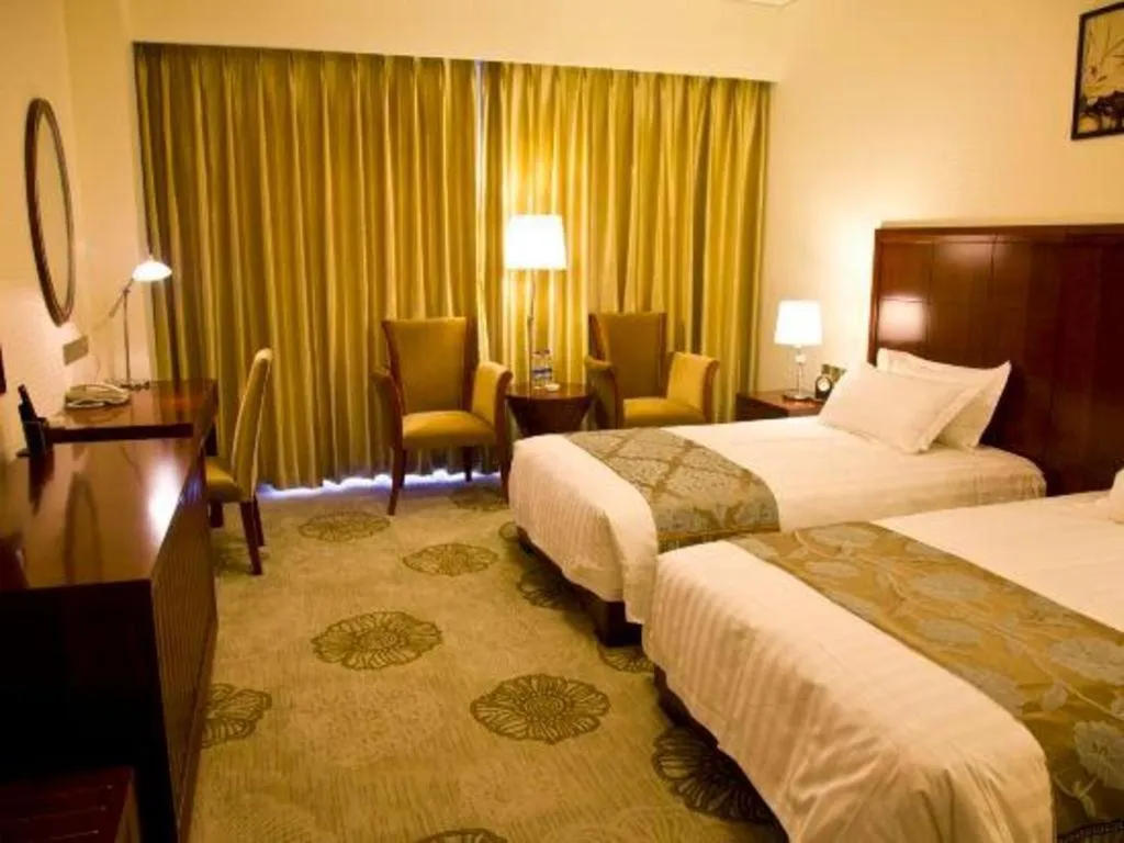 Bed in Jinjiang Hotel Qianan