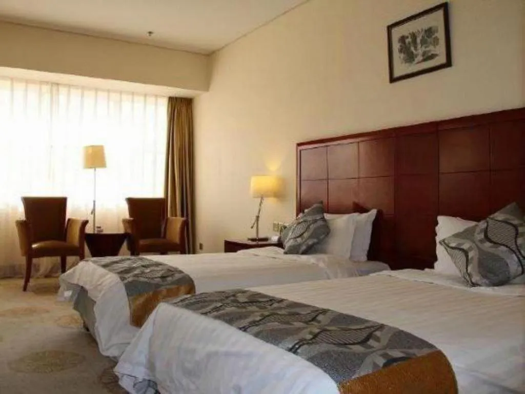 Bed in Jinjiang Hotel Qianan