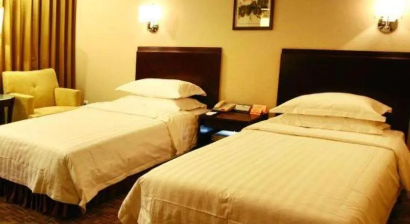 Bed in Jinjiang Hotel Qianan