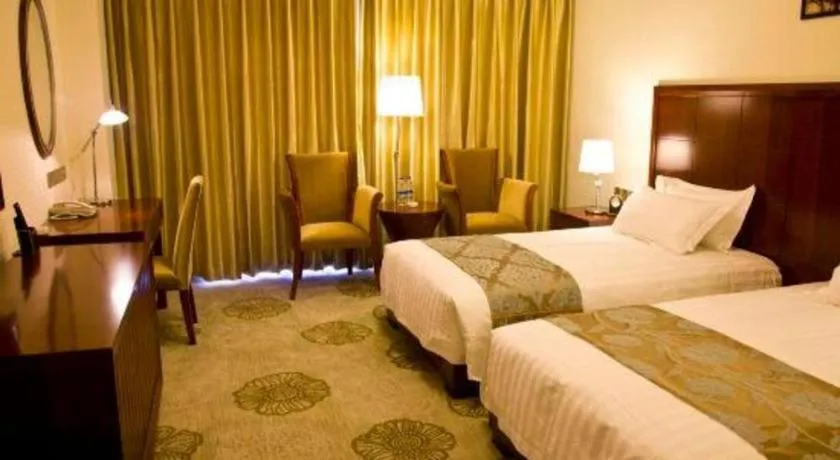 Bed in Jinjiang Hotel Qianan