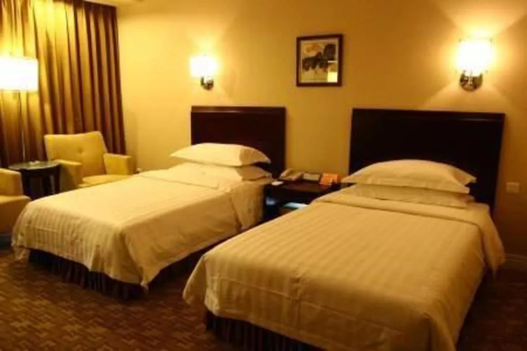 Bed in Jinjiang Hotel Qianan