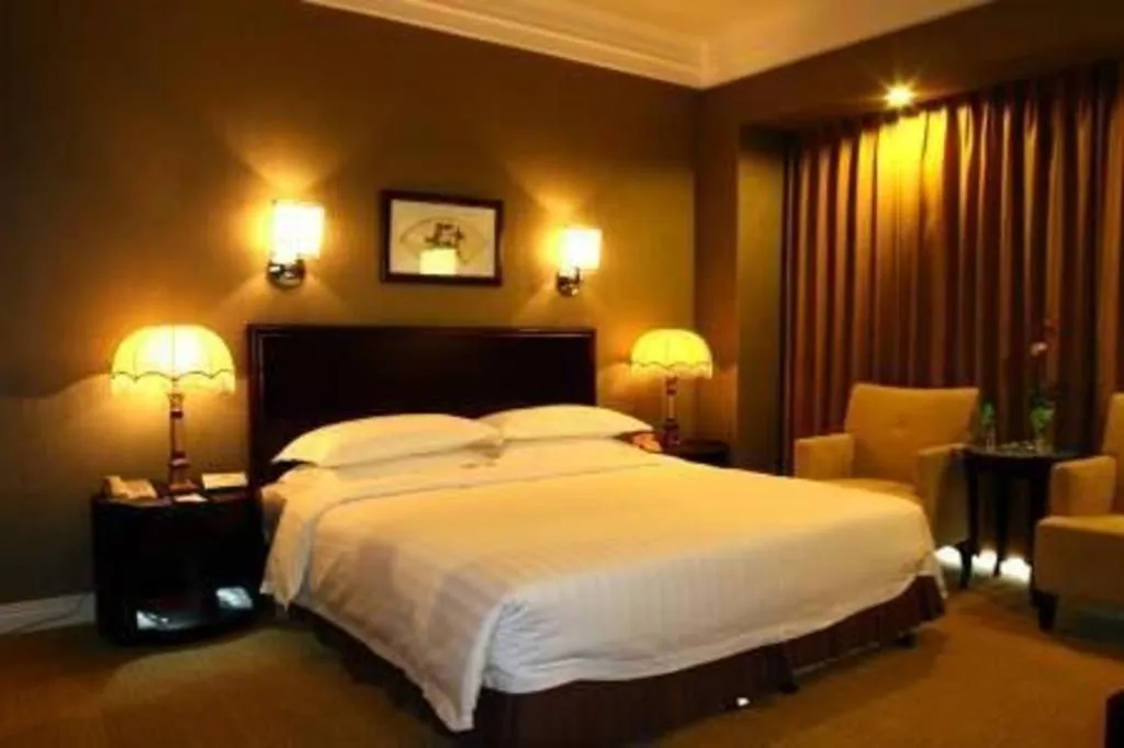 Bed in Jinjiang Hotel Qianan