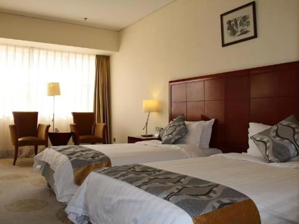 Bed in Jinjiang Hotel Qianan