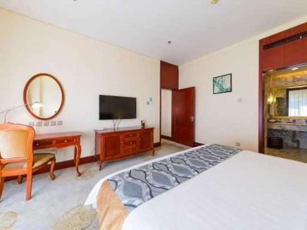 Bed in Jinjiang Hotel Qianan