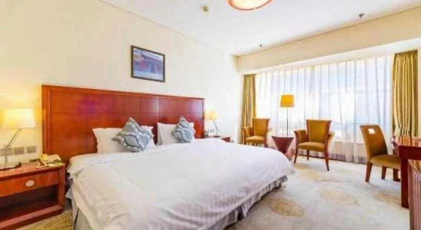 Bed in Jinjiang Hotel Qianan