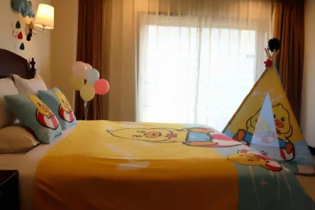 Bed in Jinjiang Hotel Qianan