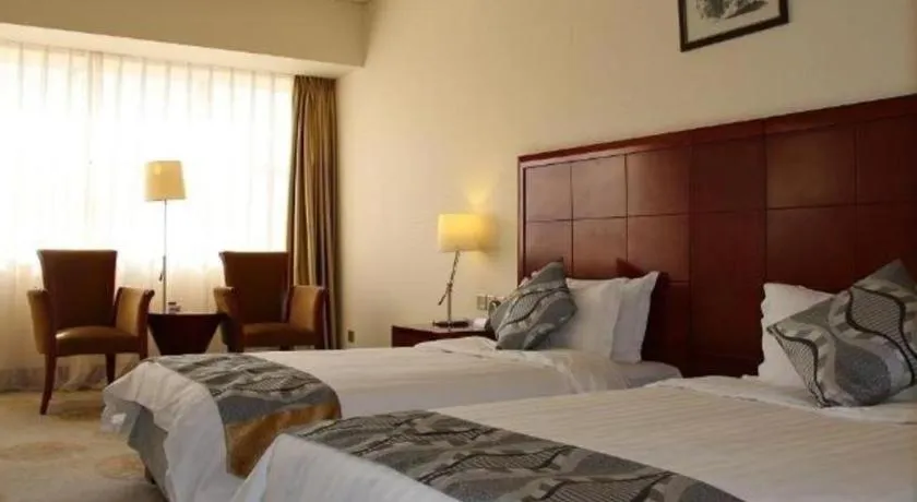 Bed in Jinjiang Hotel Qianan