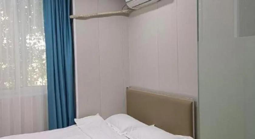 Bed in Shell Hotel Taixing Huangqiao Town Dinghui Road