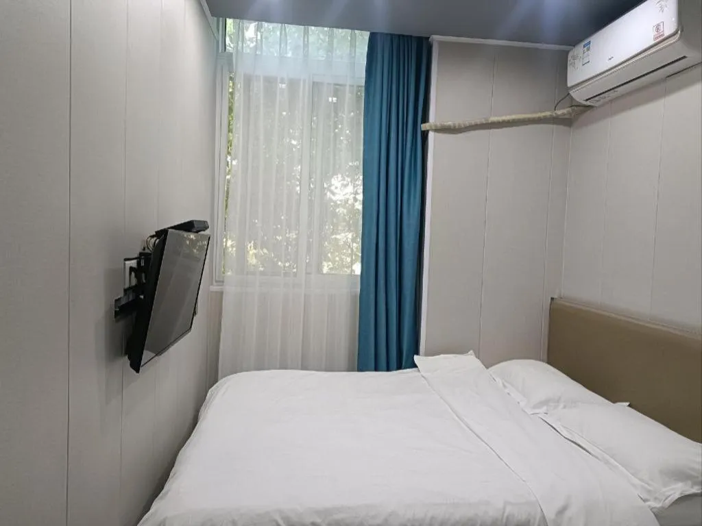 Bed in Shell Hotel Taixing Huangqiao Town Dinghui Road