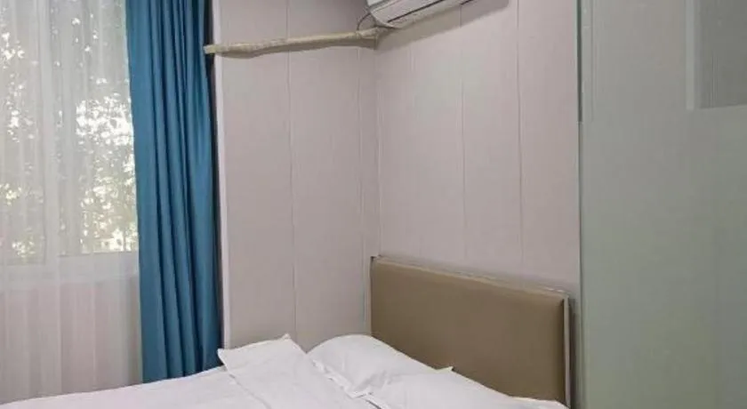 Bed in Shell Hotel Taixing Huangqiao Town Dinghui Road