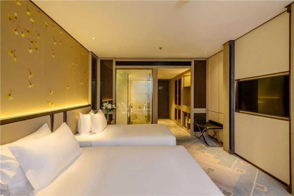 Bed in Dahe Jinjiang Hotel