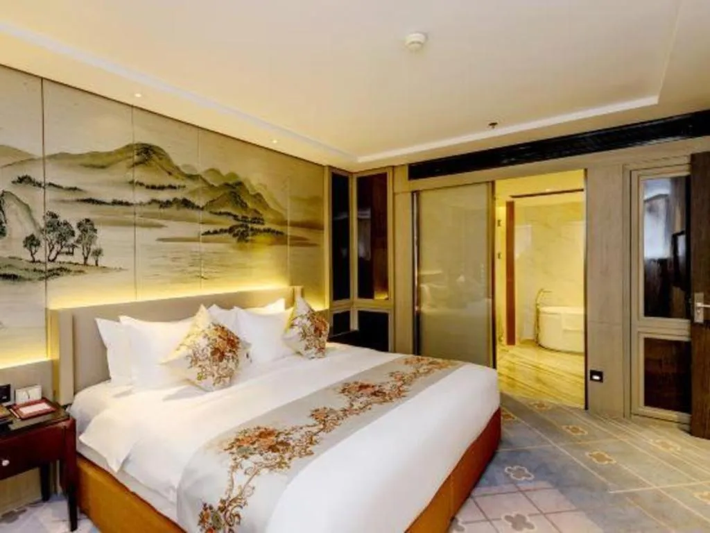 Bed in Dahe Jinjiang Hotel