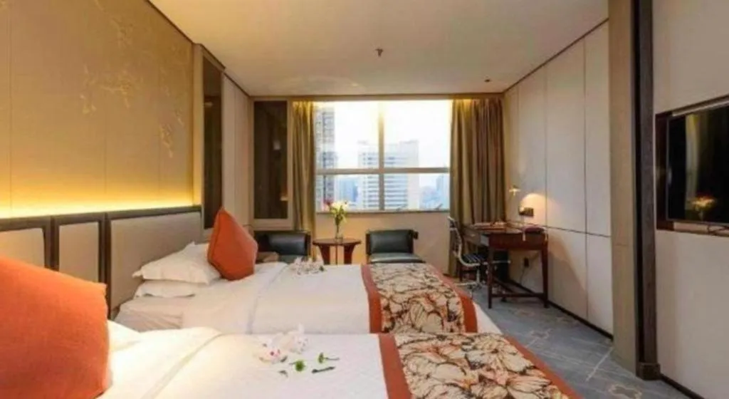 Bed in Dahe Jinjiang Hotel