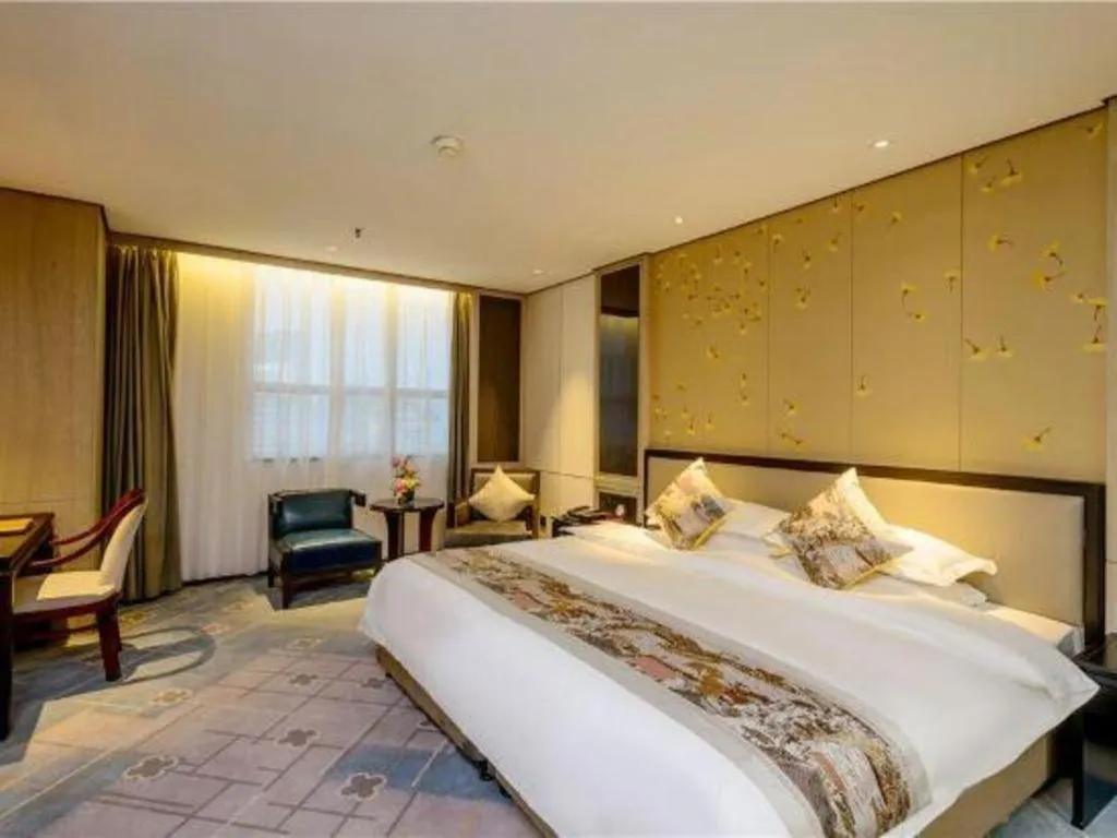 Bed in Dahe Jinjiang Hotel