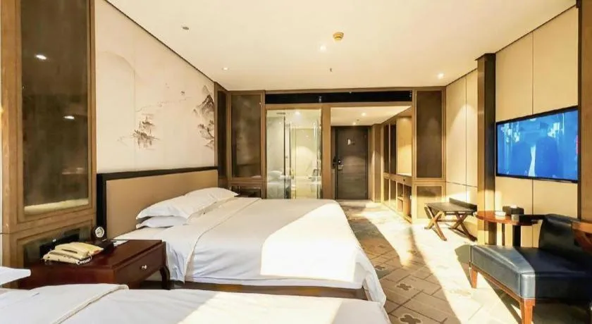 Bed in Dahe Jinjiang Hotel